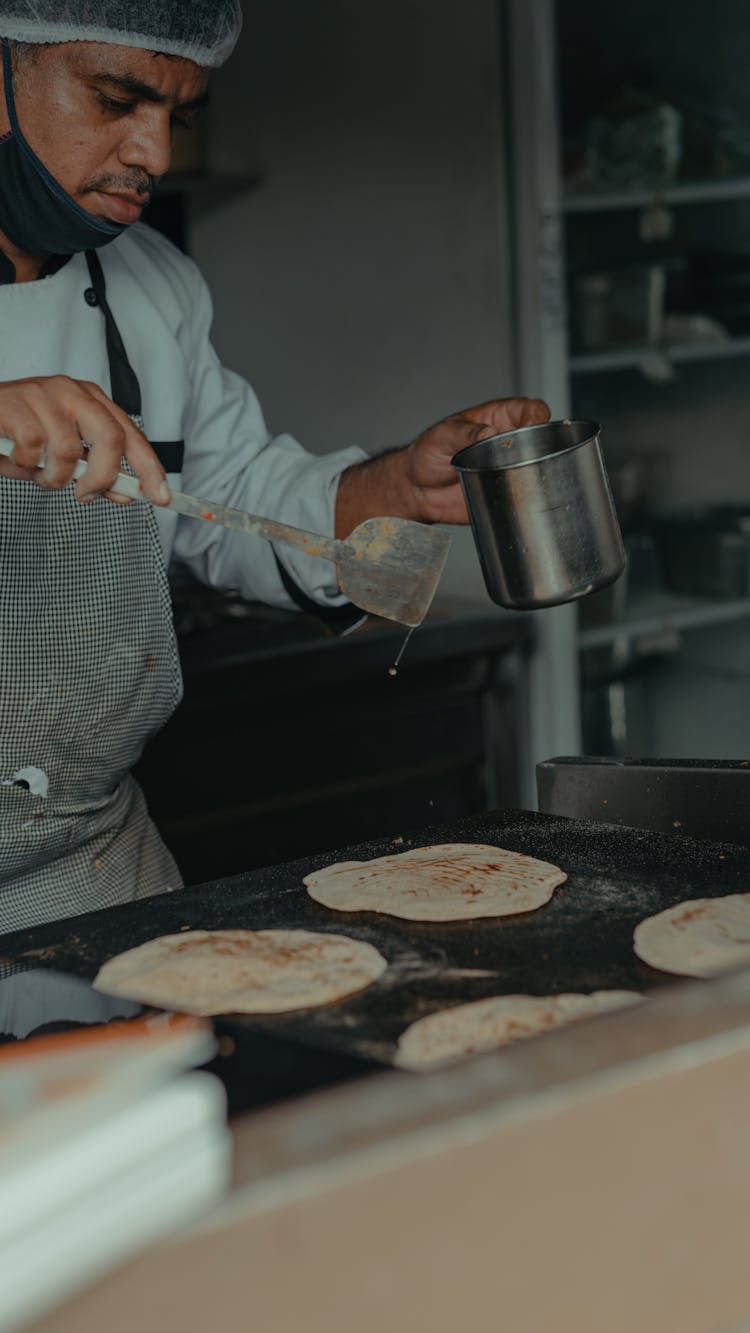 Man Cooking In A Restaurant 