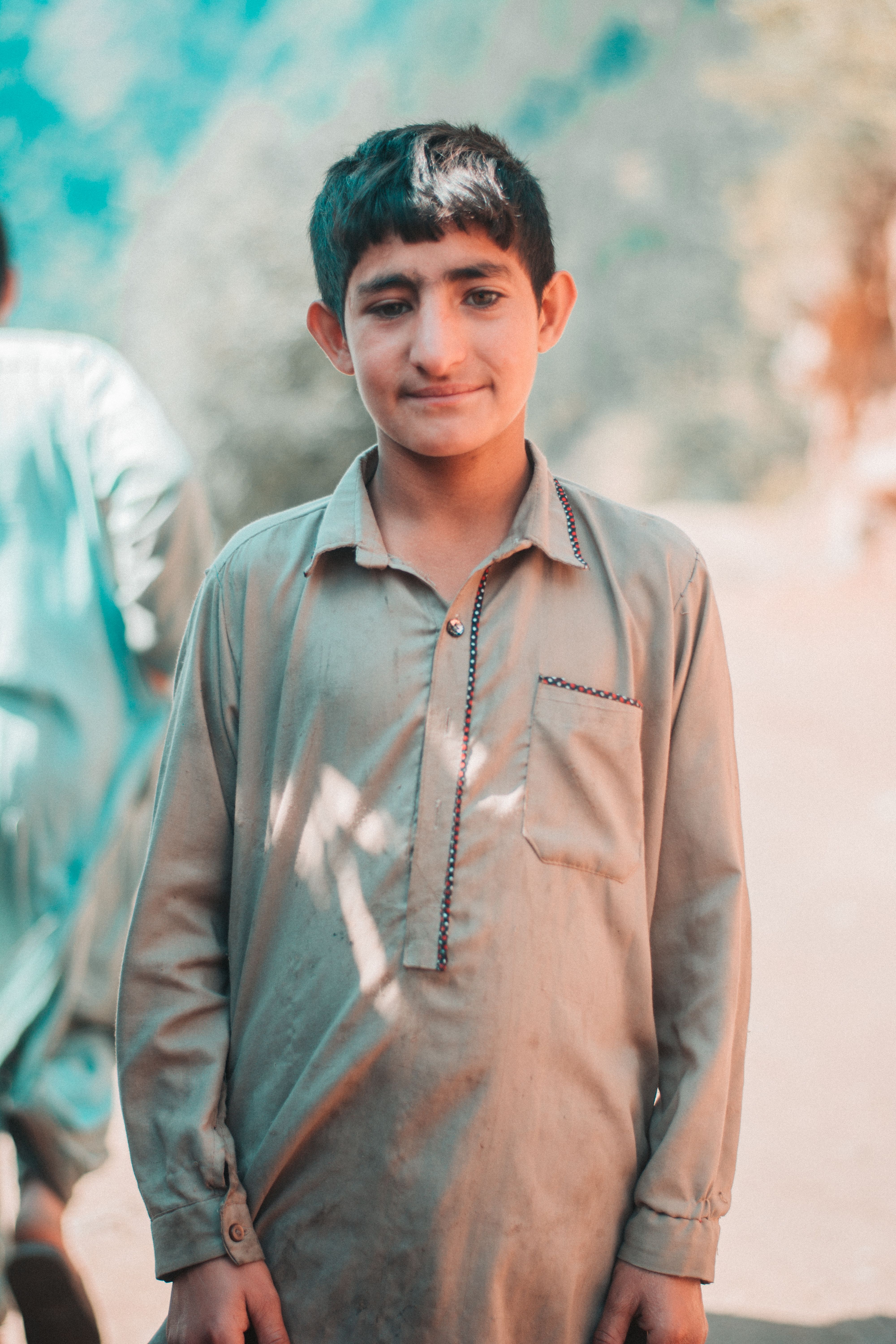 Portrait of a Smiling Young Boy Outdoors · Free Stock Photo