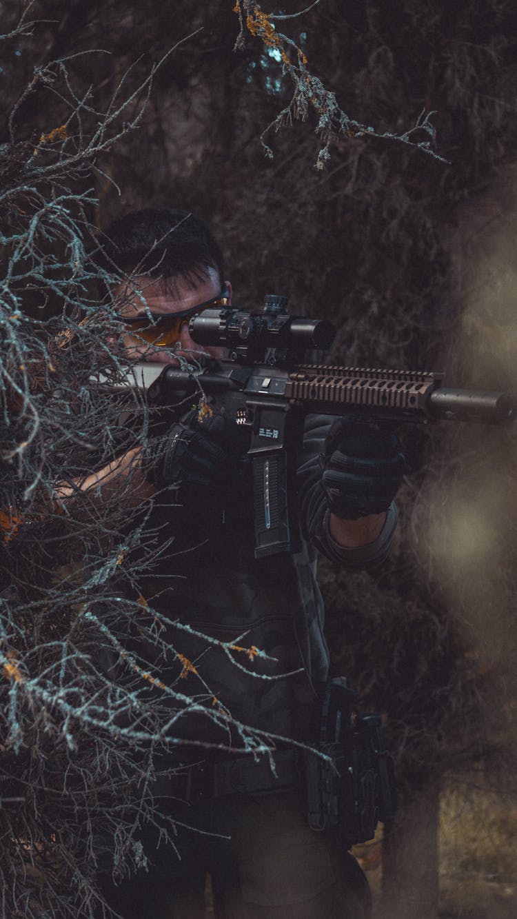 A Soldier Holding A Rifle