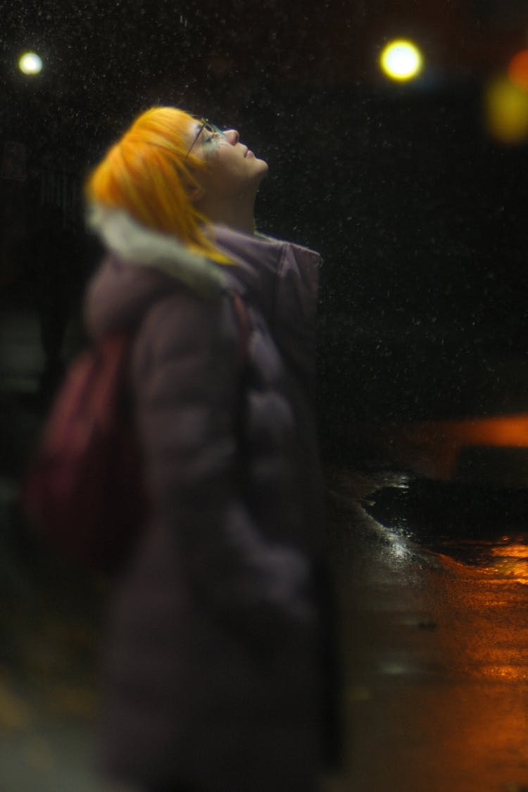 Redhead Woman In Coat Looking Up