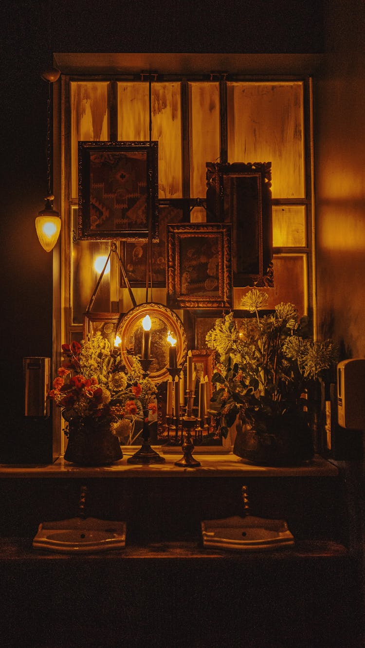 Wax Candles, Flowers And Images On Window