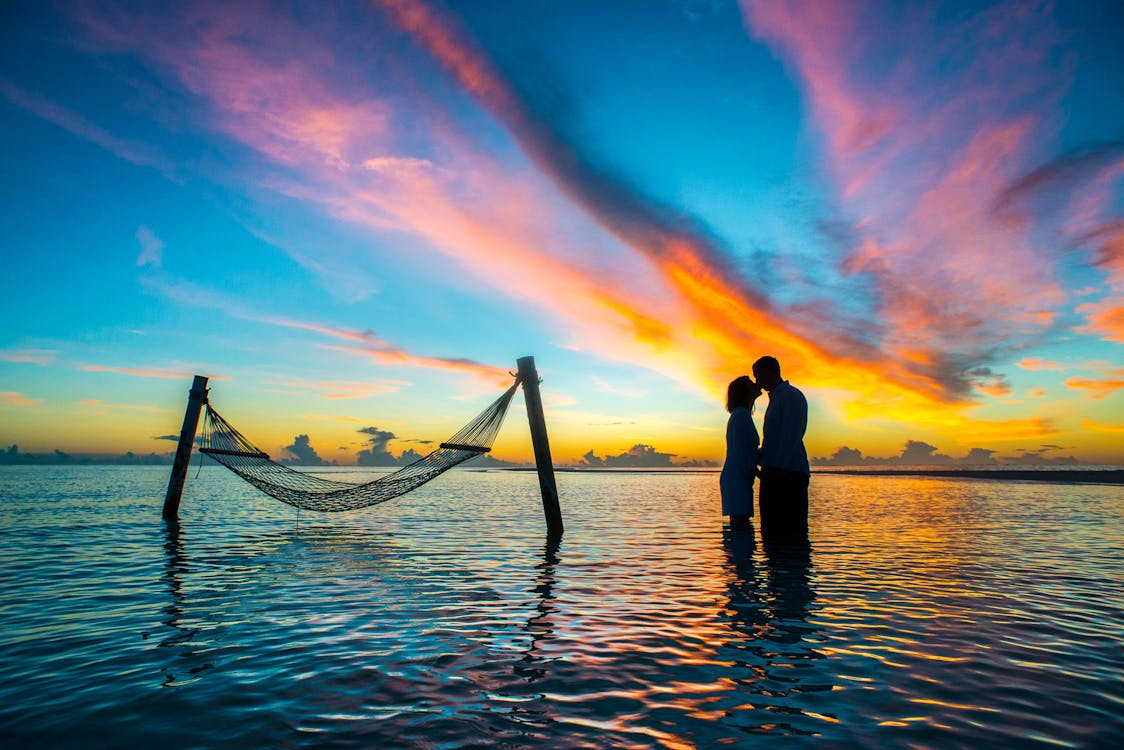 Silhouette Photo Couple Kissing Each Other during Sunset