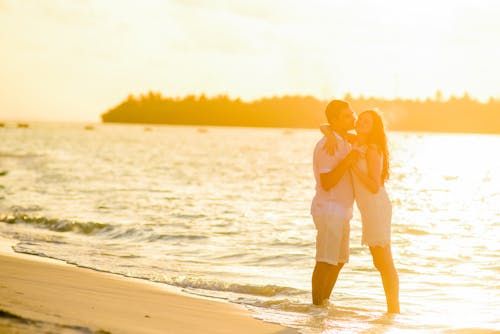 Free Hugging Woman and Man in Beach Stock Photo