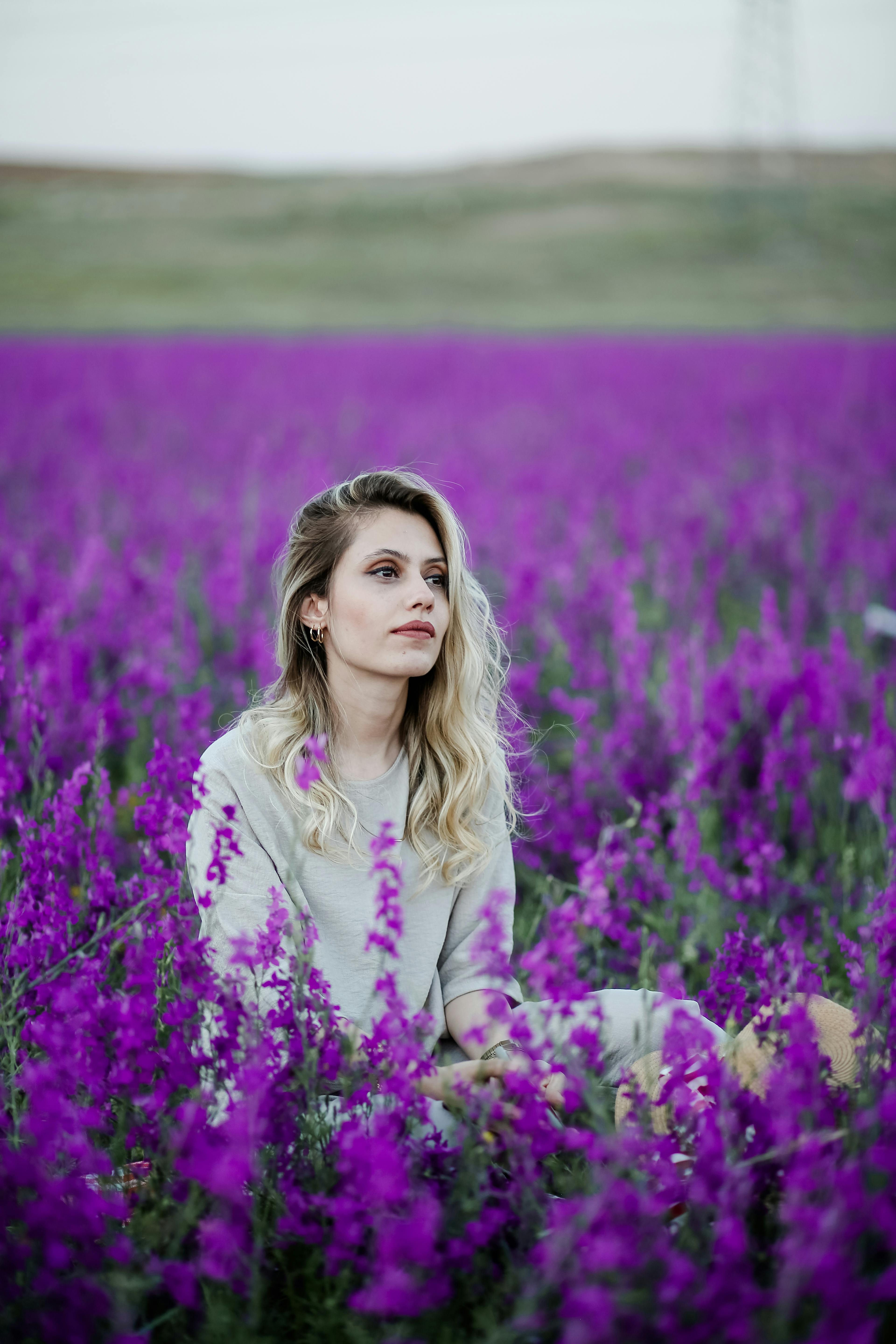 Woman Touching Wild Flowers · Free Stock Photo