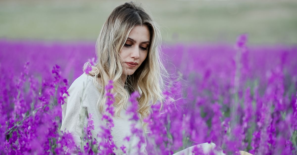 Woman In Flowers Photo of Woman in the Flower Field · Free Stock Photo