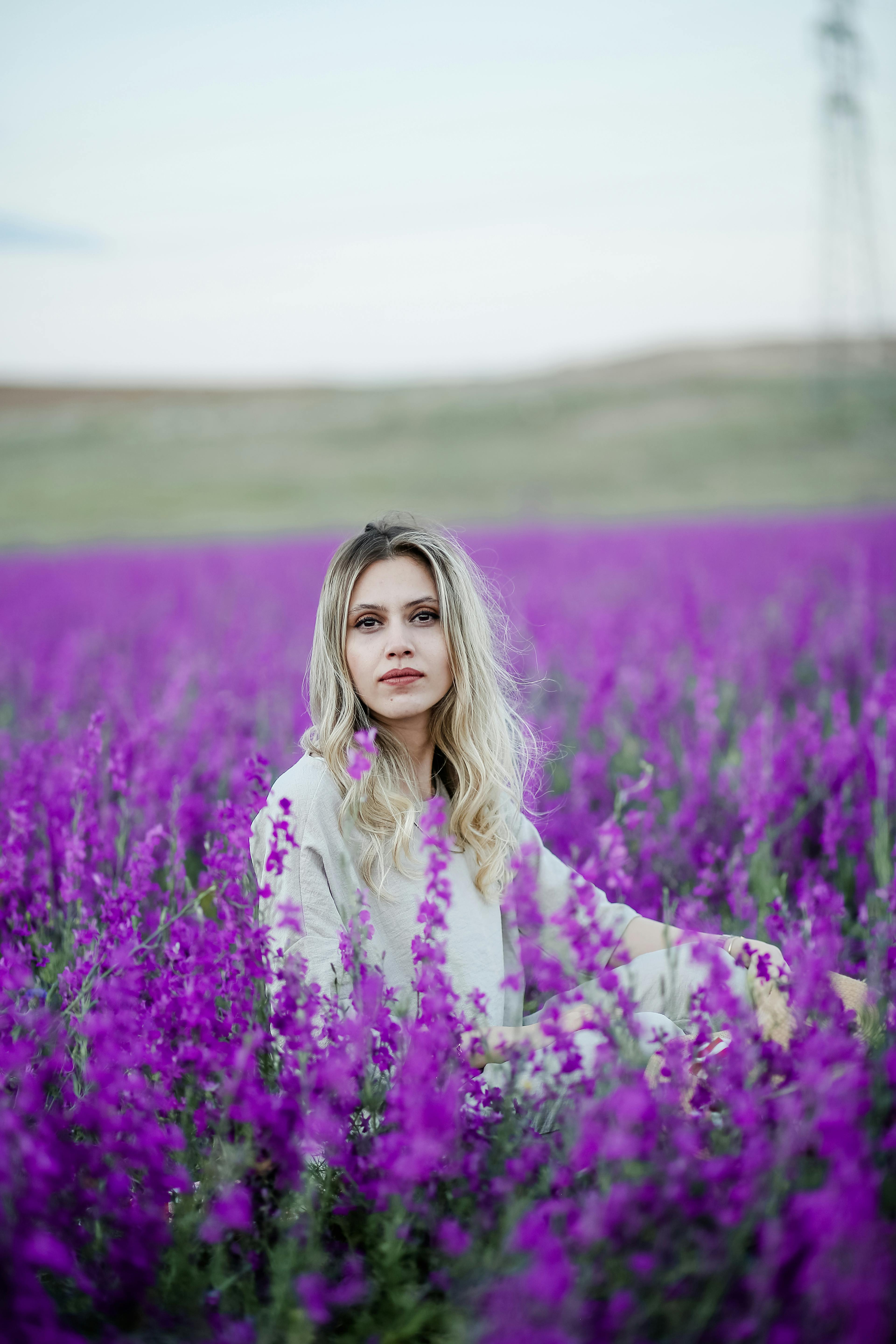 Woman Touching Wild Flowers · Free Stock Photo