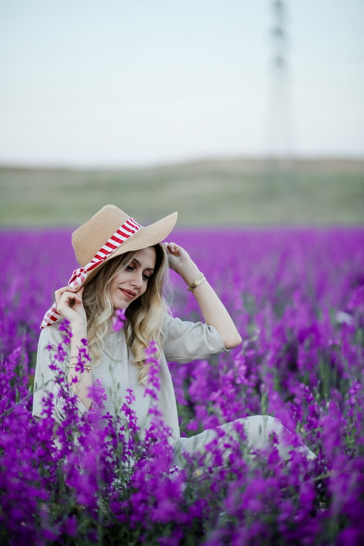 Woman In Hat On Meadow