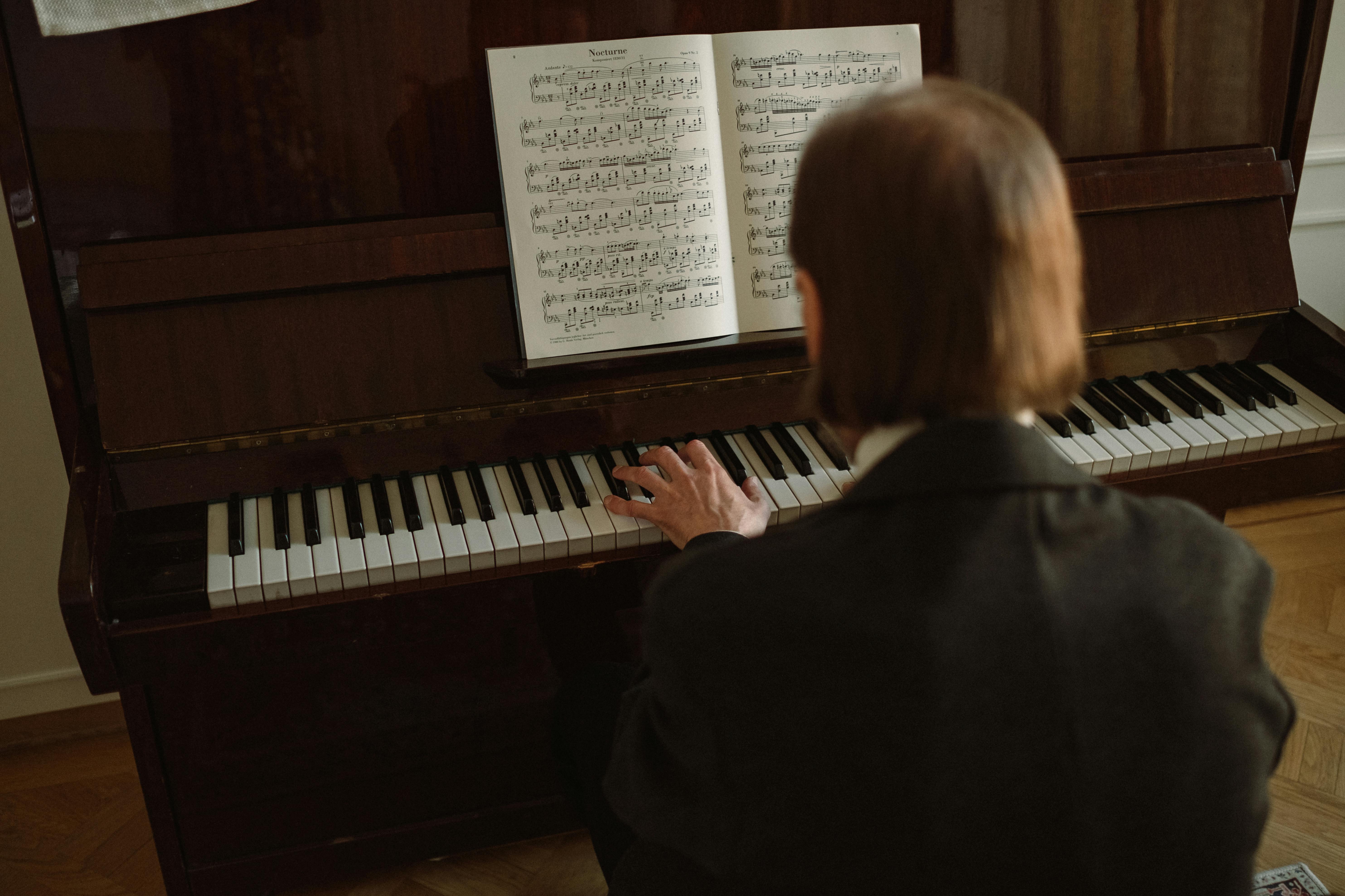 photo of a person playing piano