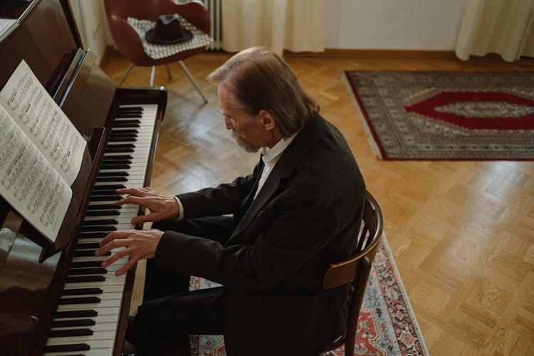 Man In A Suit Playing The Piano