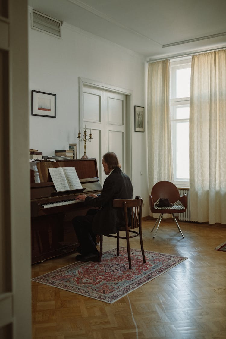 Man In A Suit Playing The Piano