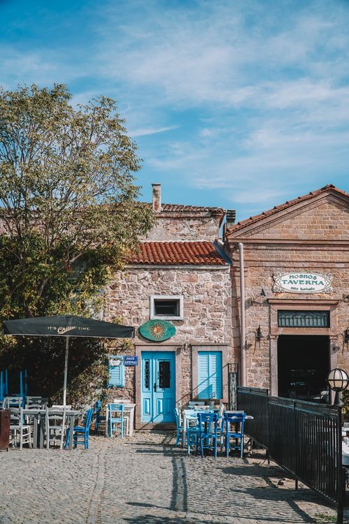 Free Quaint outdoor seating of a rustic taverna in Balıkesir, Turkey. Stock Photo