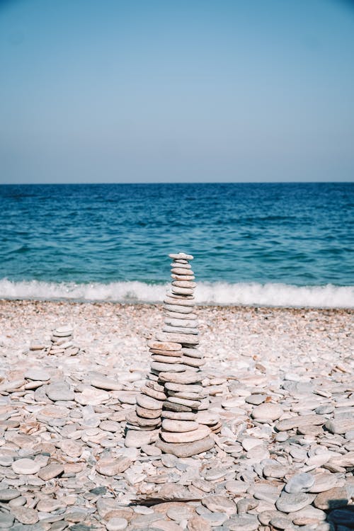 Free A Stack of Rocks on a Rocky Beach Stock Photo