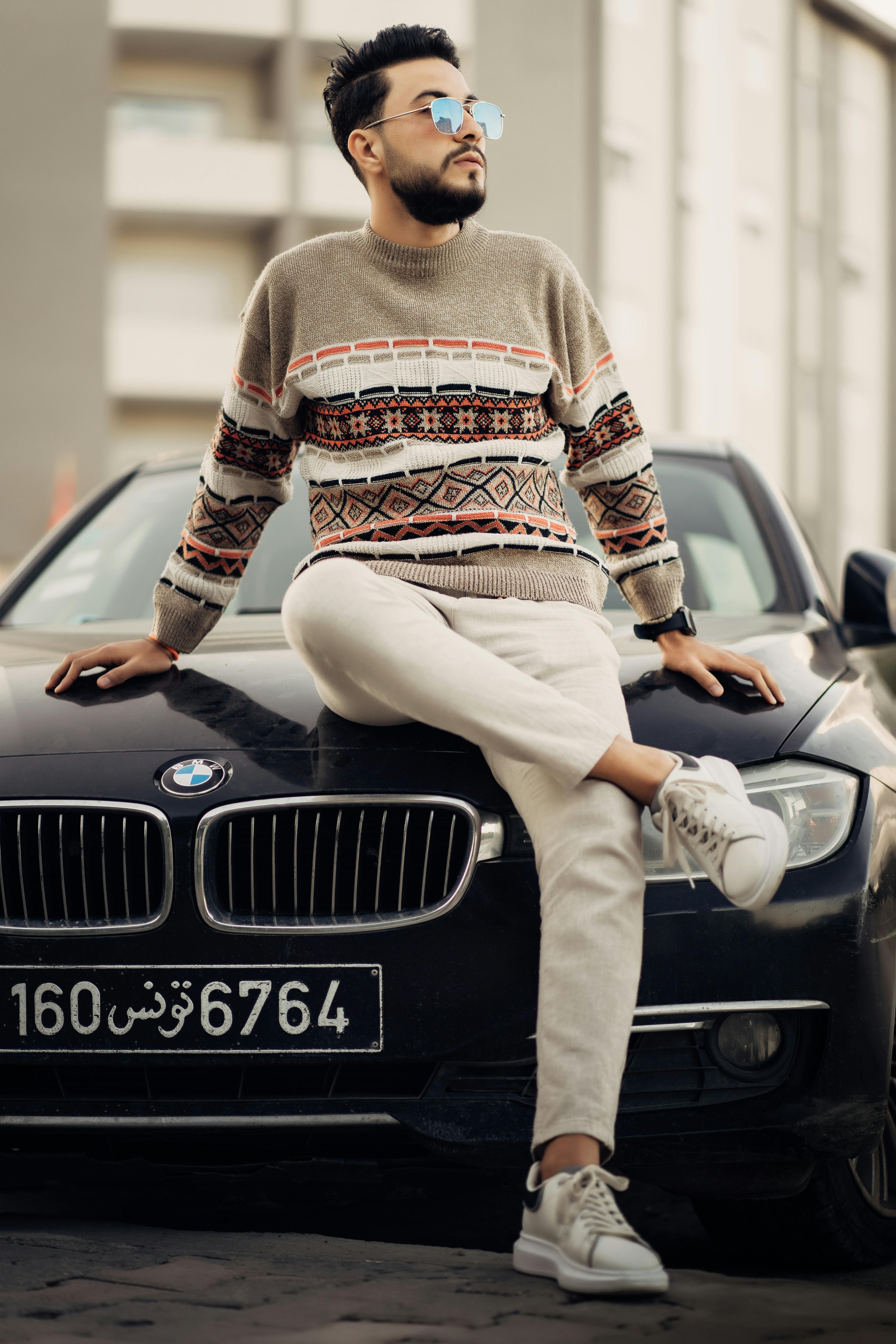 Man Holding a Car Key to a BMW · Free Stock Photo