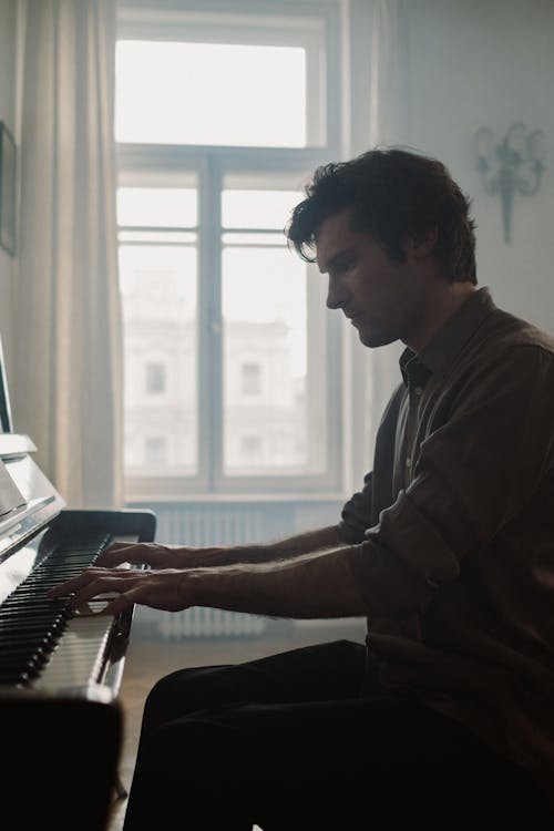 Photo of a Man Playing Piano