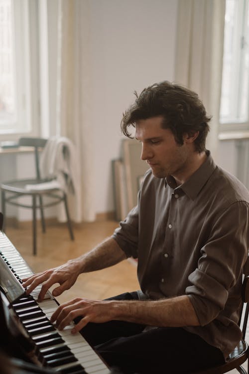 Photo of a Person Playing Piano