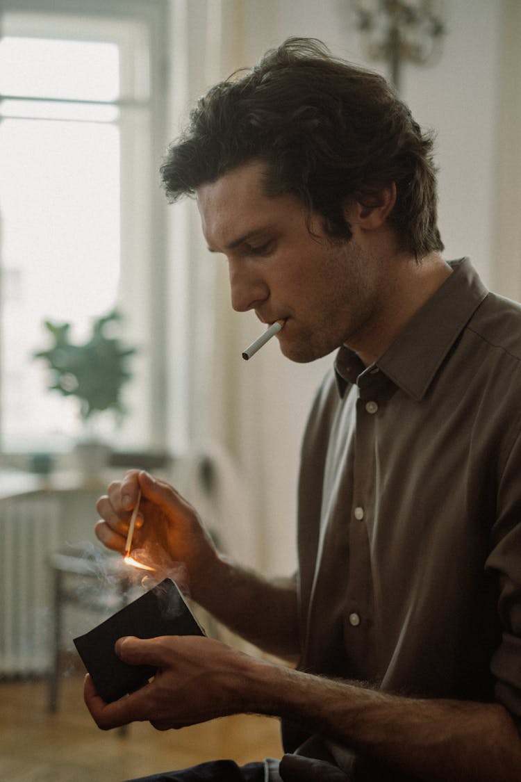 Man Holding A Matchstick