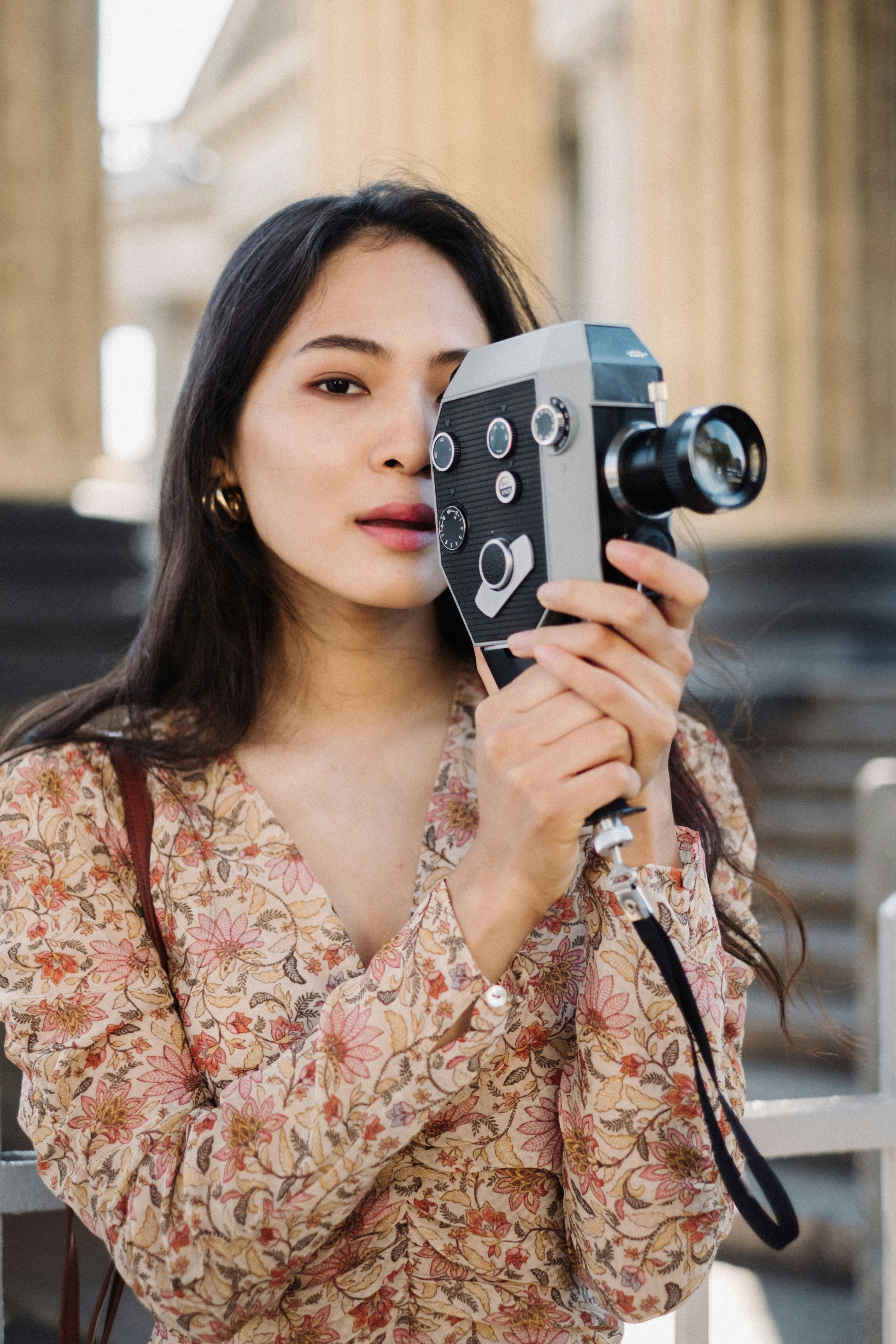 Woman Filming with Analog Camera · Free Stock Photo