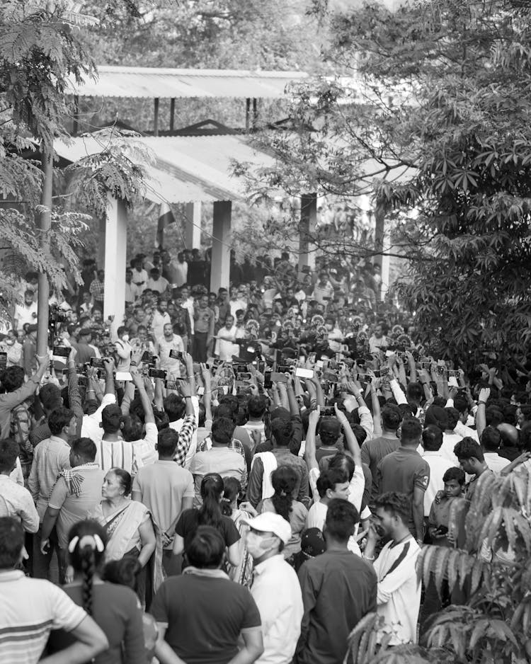 Crowd Gathering In Black And White