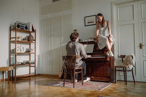 A Young Couple by the Piano