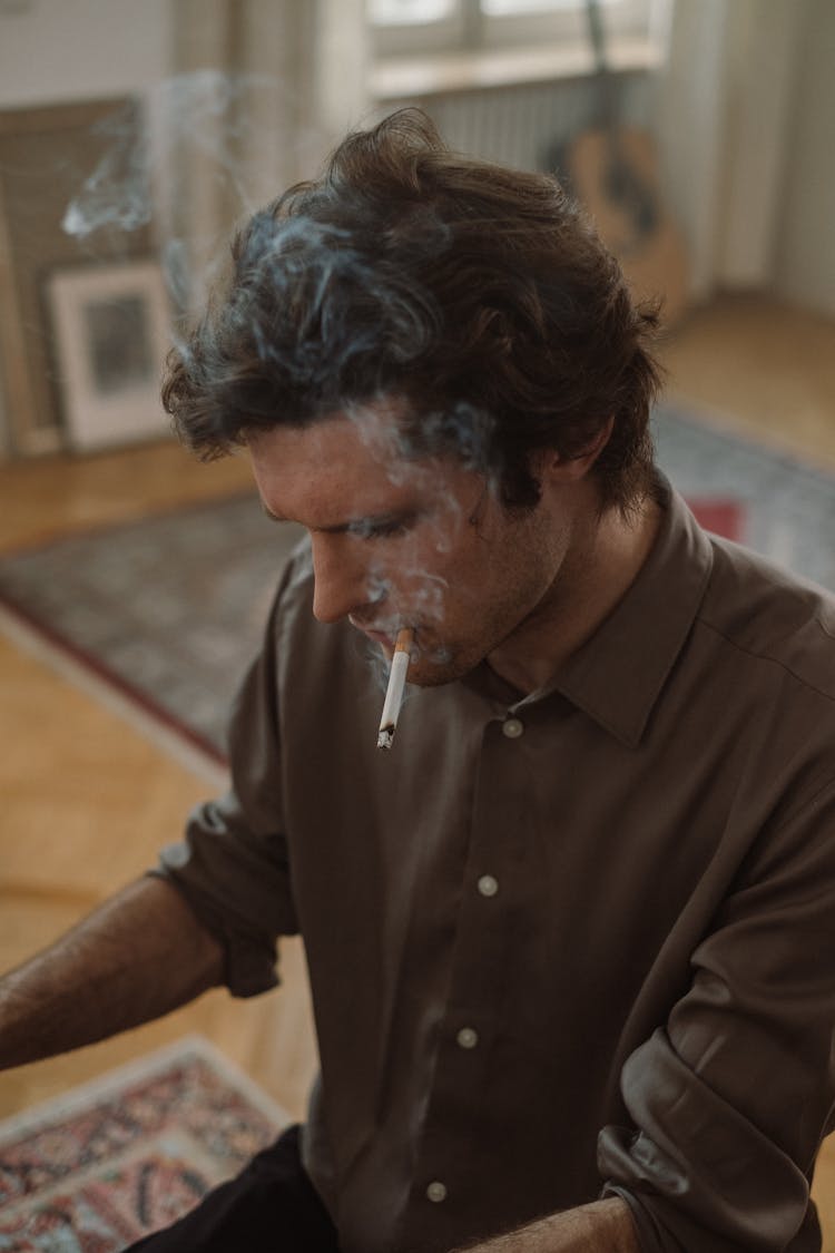 Close Up Photo Of A Man Smoking Cigarette