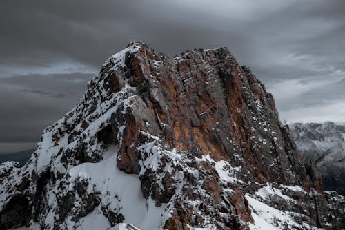 Free Rocky Mountain under Gray Sky Stock Photo