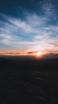 Beautiful sunset over mountains in Brazil with vibrant skies, perfect for serene backgrounds.
