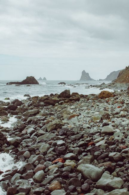 Explore the rugged rocky shoreline of Santa Cruz de Tenerife with ocean views.