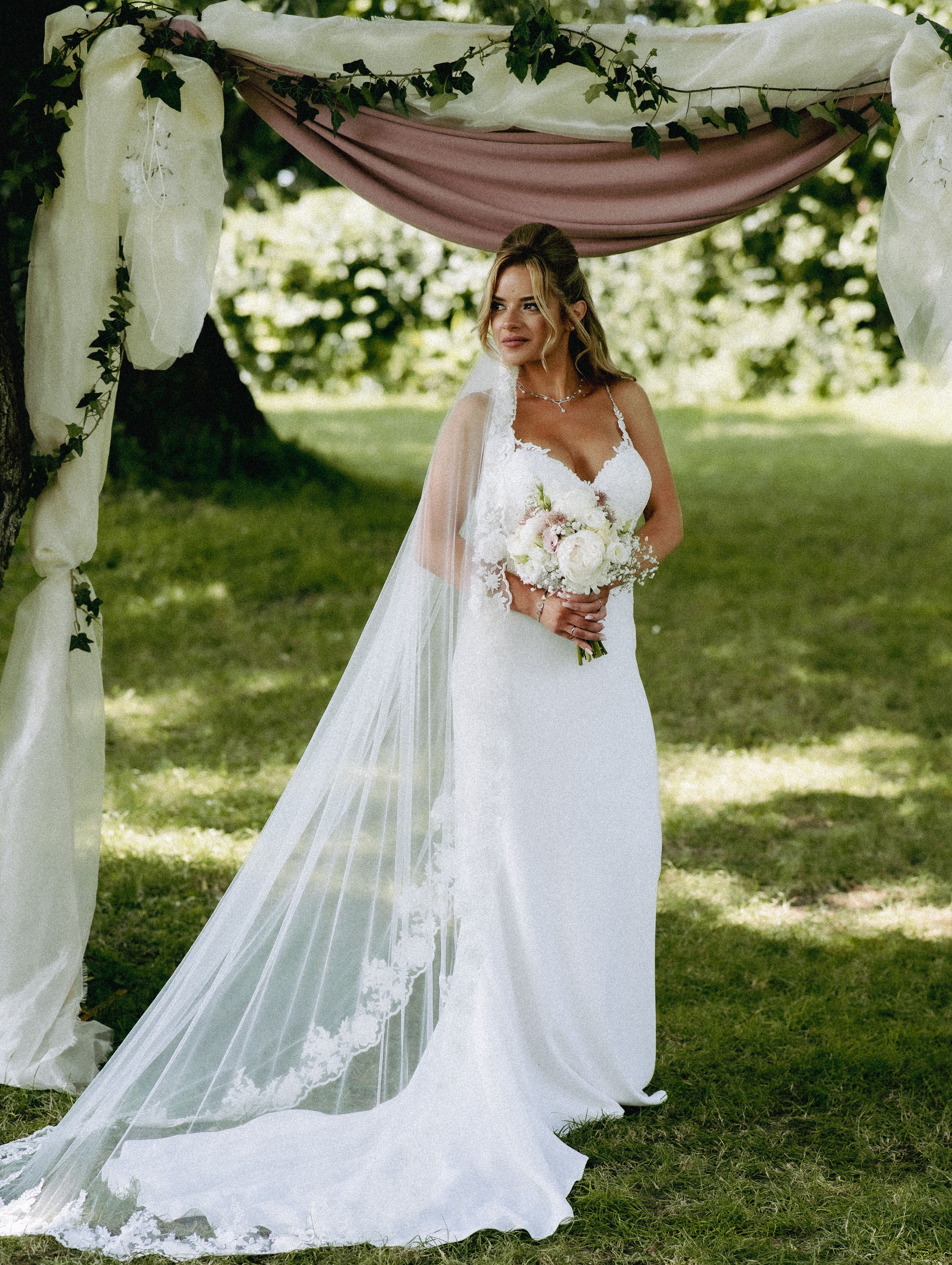 Woman in White Wedding Dress Standing on Grass · Free Stock Photo