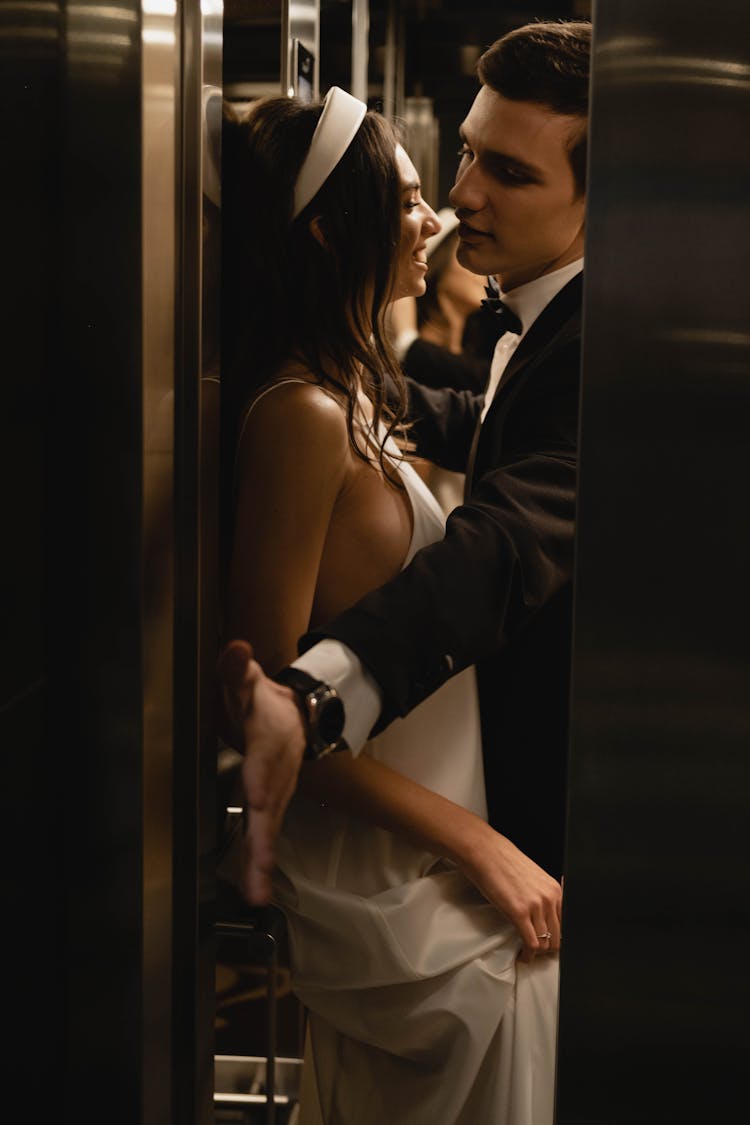 A Newlywed Couple At The Elevator