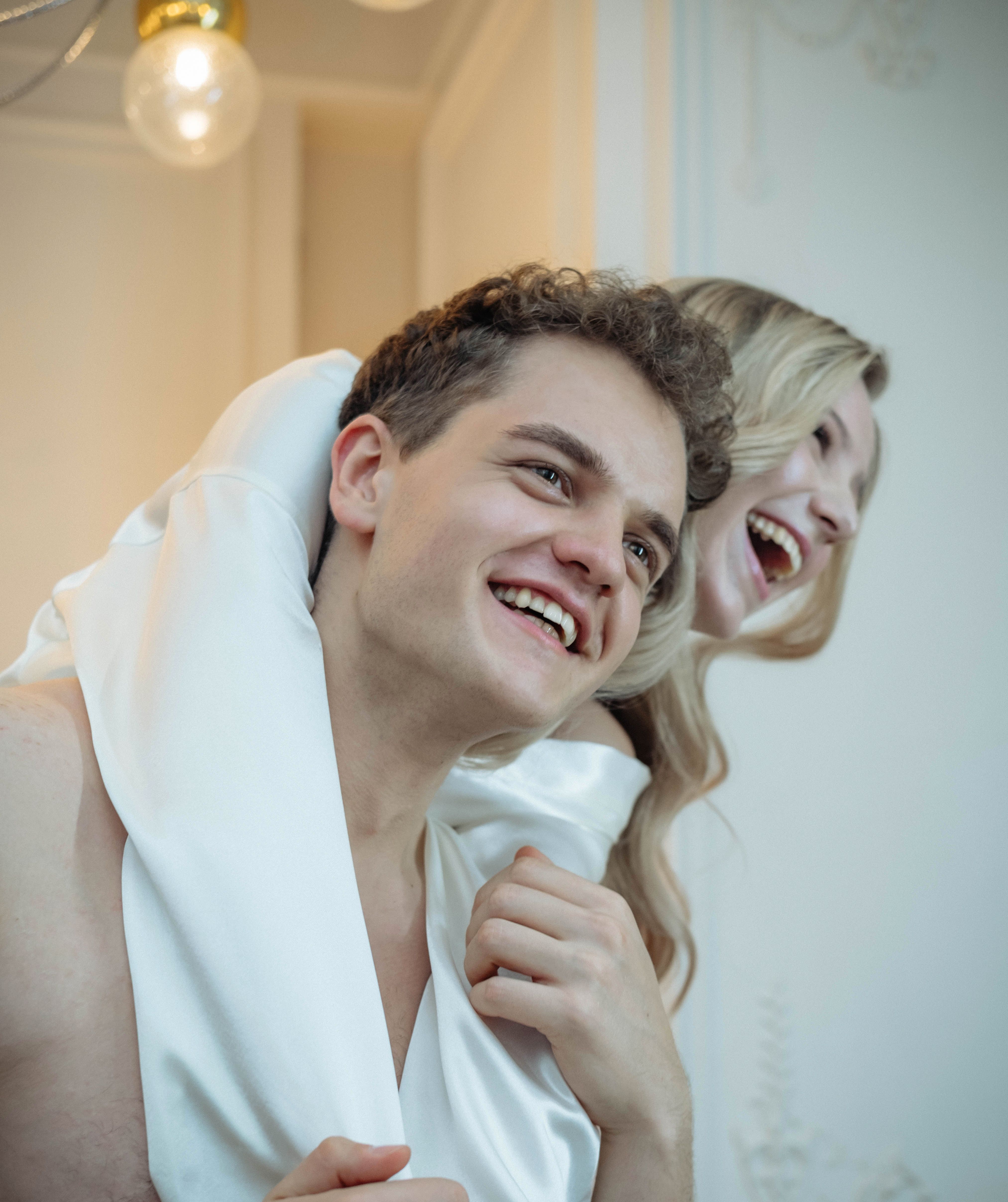 Happy Woman Hugging a Man from Behind · Free Stock Photo