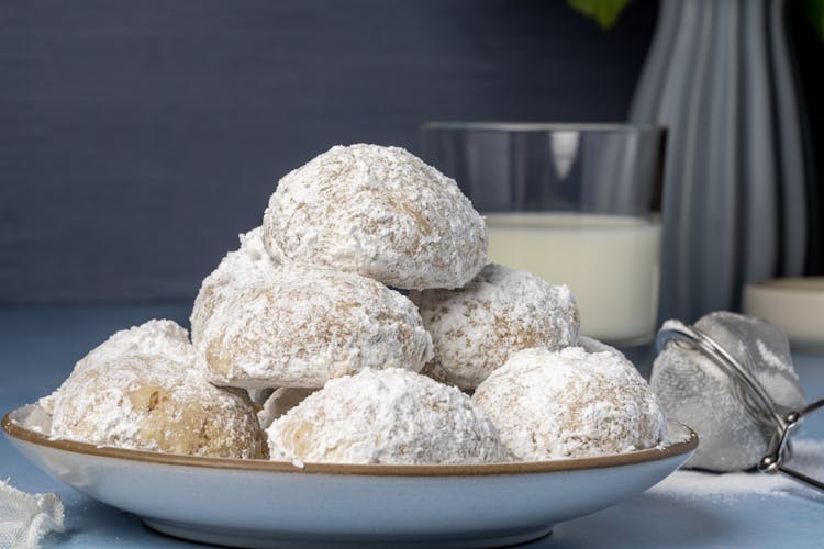 Close-Up Shot Of Kourabiedes On A Ceramic Plate