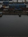 Blue and Red Concrete Building Beside Body of Water