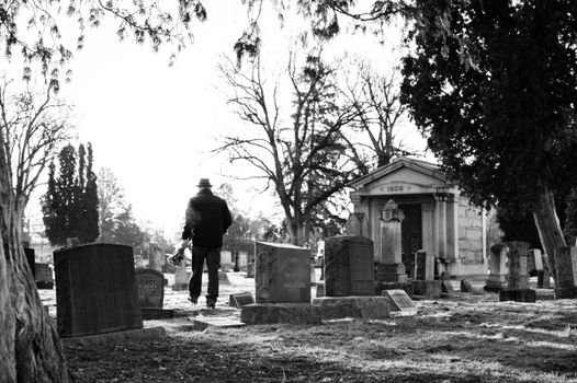 A Person Walking on The Cemetery