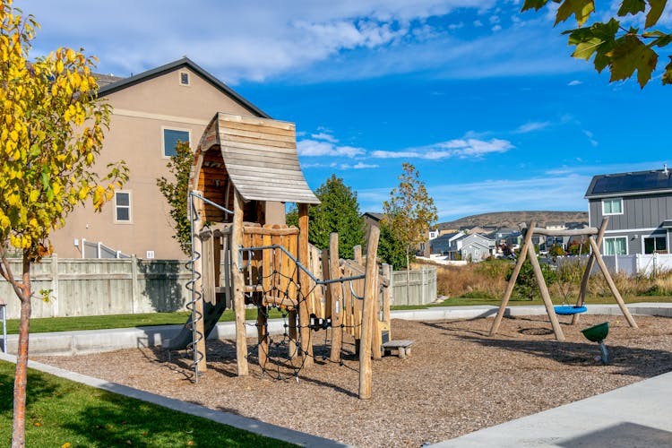 Wooden Swing And Slide On A Playground