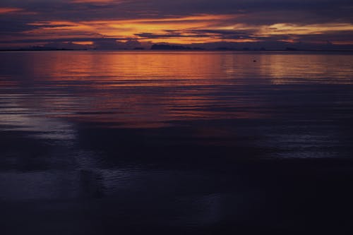 Calm Water in the Sea During Golden Hour