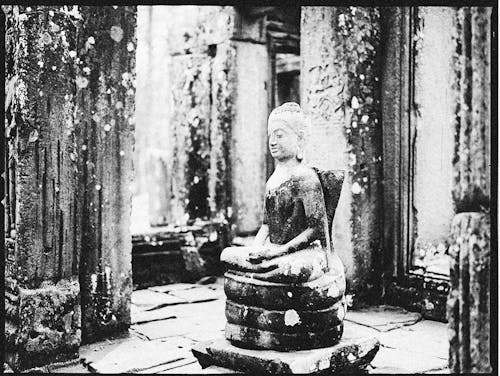 Grayscale Photo of Buddha Statue