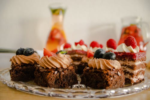 Free Slices of Chocolate Cakes with Fruit Toppings Stock Photo