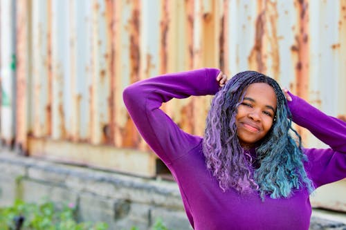 Woman in Colorful Hair Smiling at the Camera