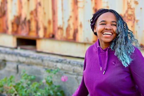 Happy Woman in Purple Hoodie Looking Afar