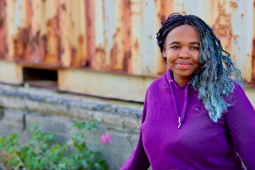 A Woman Wearing a Purple Hoodie 