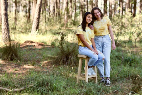 Women in Yellow t Shirts Posing in the Forest