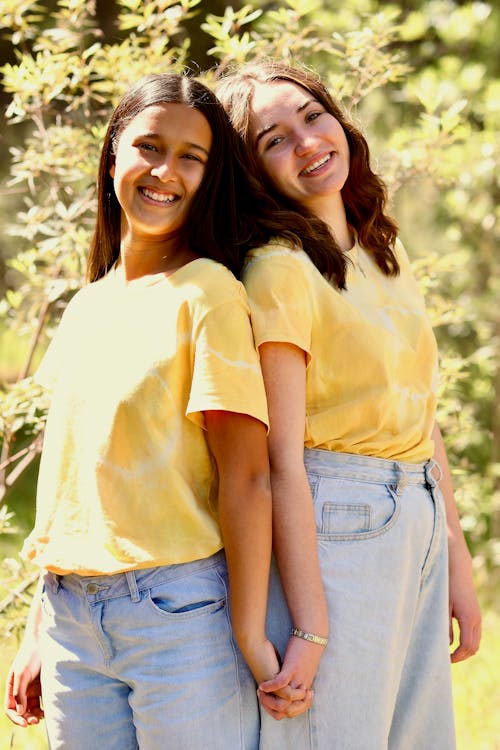 Smiling Girls in Yellow T-shirts