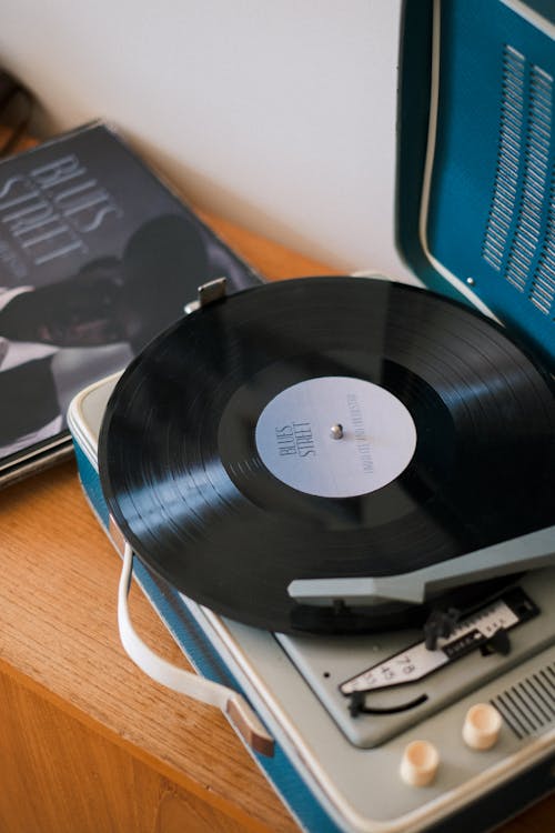 Black Vinyl Record Playing on Old Turntable