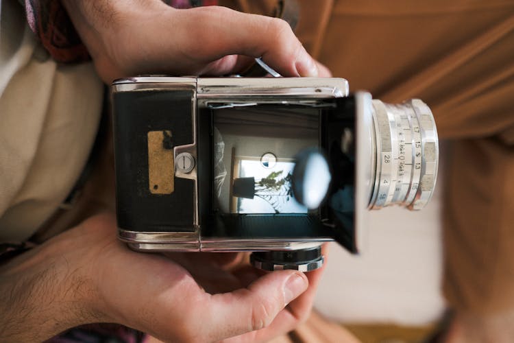 Analog Camera In Someones Hands