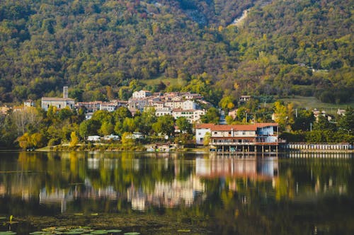 View of Waterfront Houses on a Lakeshore in a Mountain Valley 