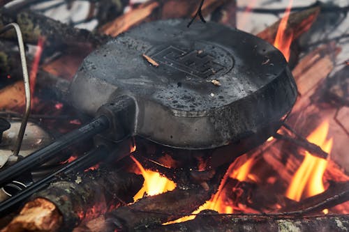 A Pie Iron Over the Campfire