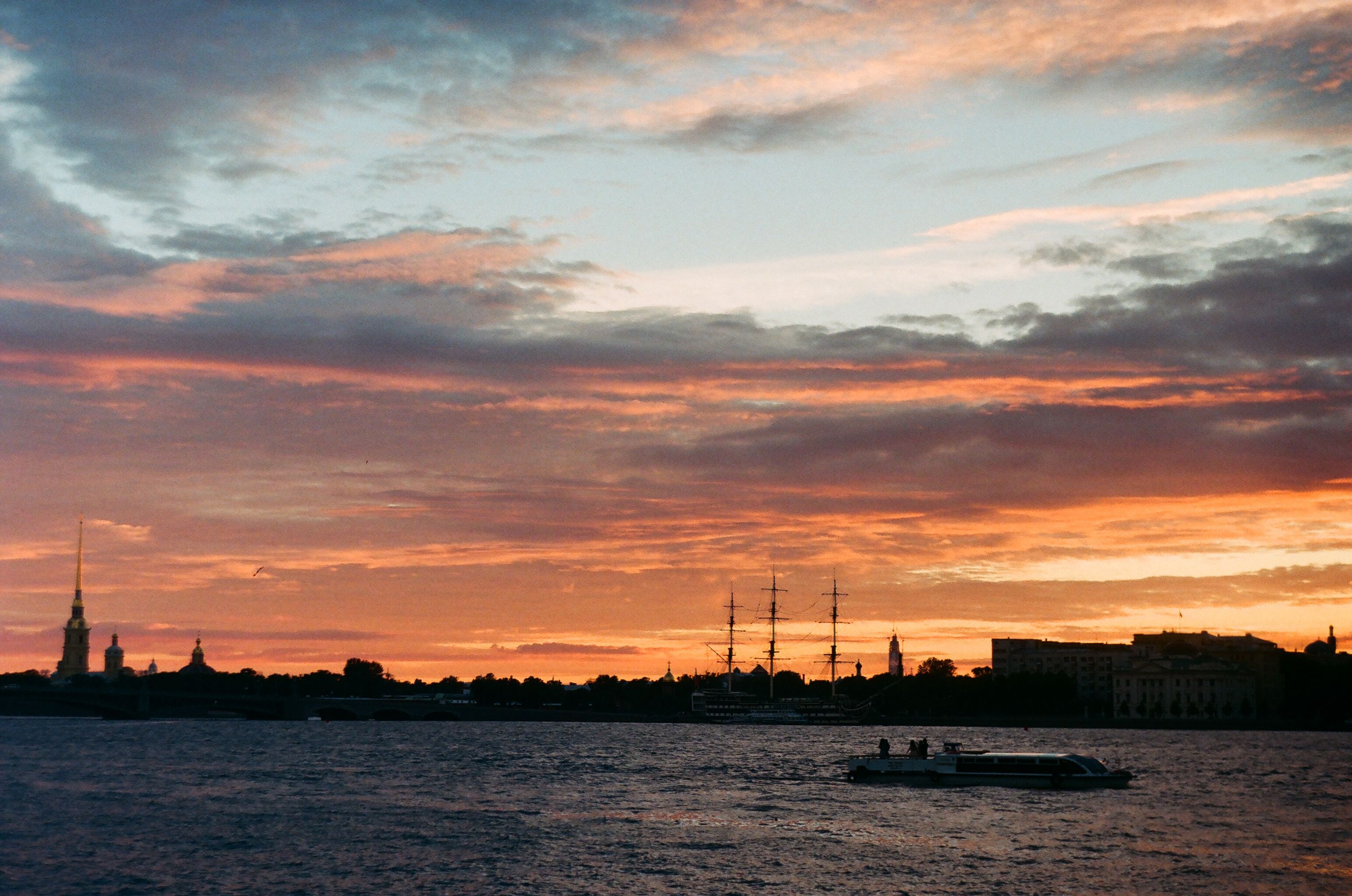 Silhouette of Boat Sailing During Golden Hour · Free Stock Photo