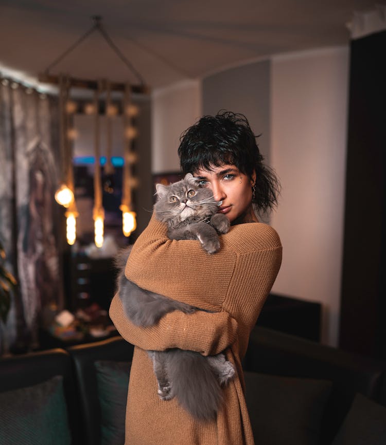 A Woman Hugging Her Pet Cat 