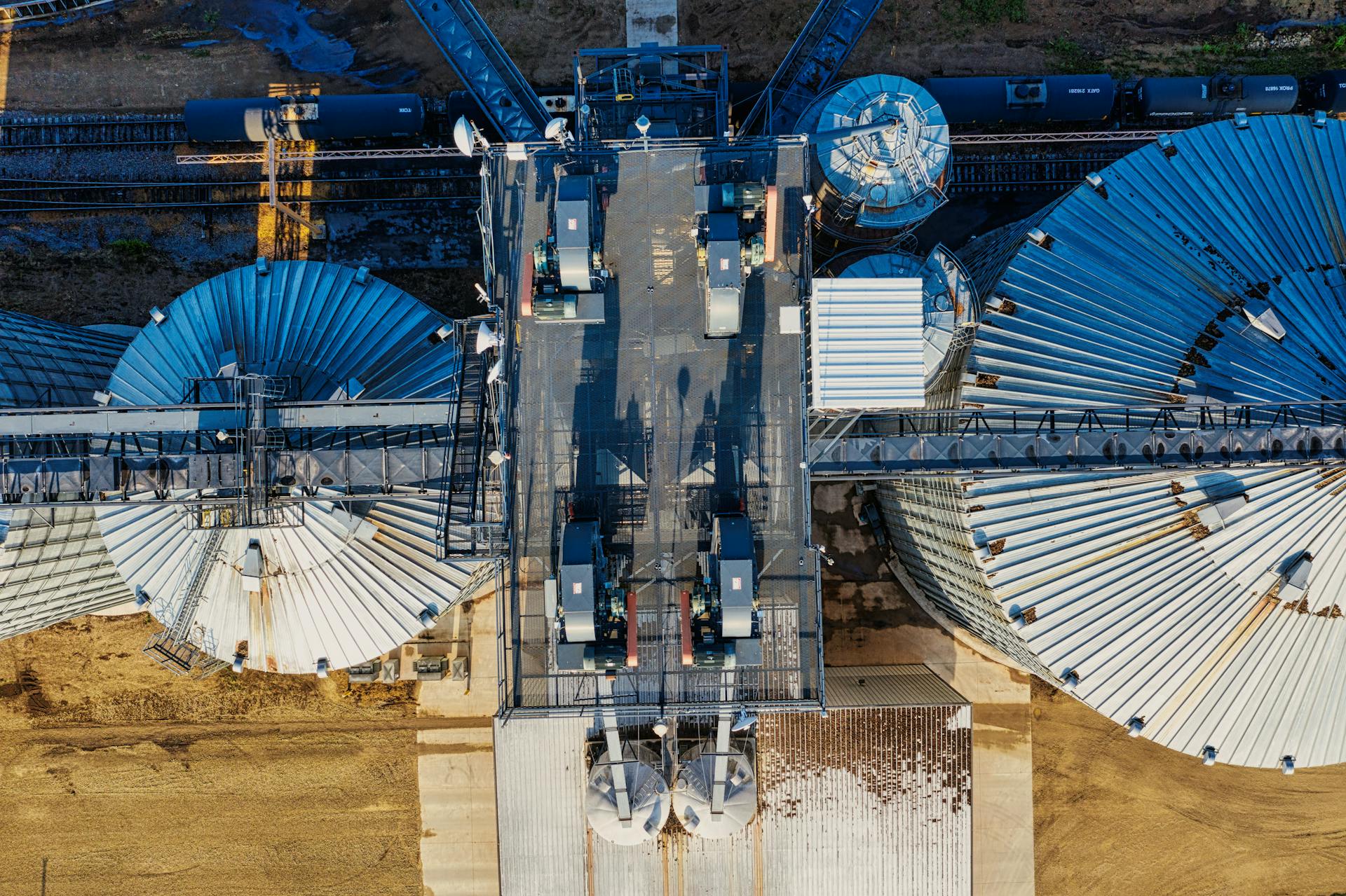 Aerial shot of industrial silos and railway tracks in Randolph, showcasing storage facilities.