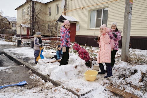 Cute Girls Playing with Snow